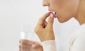 The girl takes a pill